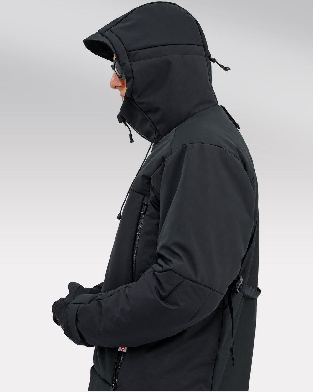 Waterproof Puffer Jacket Hinohe in black - side profile with hood up