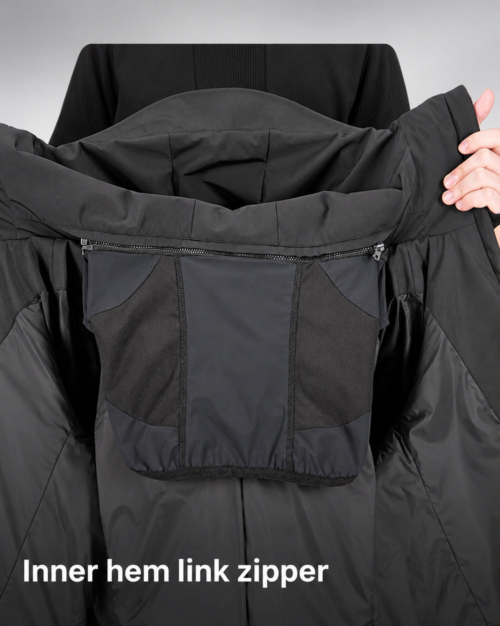 Waterproof Puffer Jacket Hinohe in black - inner hem zipper linking system