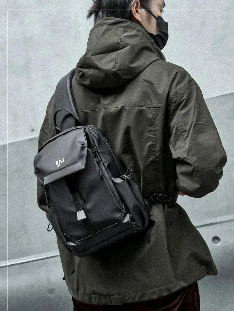 man wearing the Backpack crossbody "Fuku"