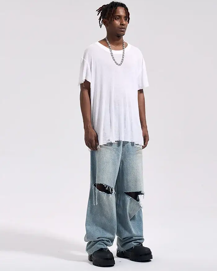 black man wearing the Y2k baggy jeans "Yabu"