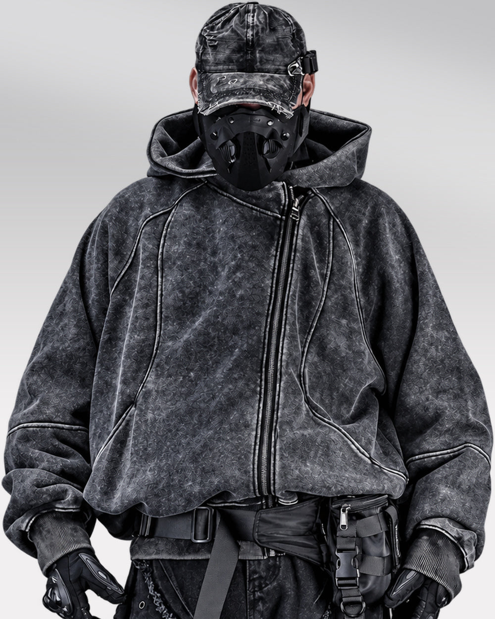 Asymmetrical zipper hoodie "Ama" in black, front view fully zipped on model