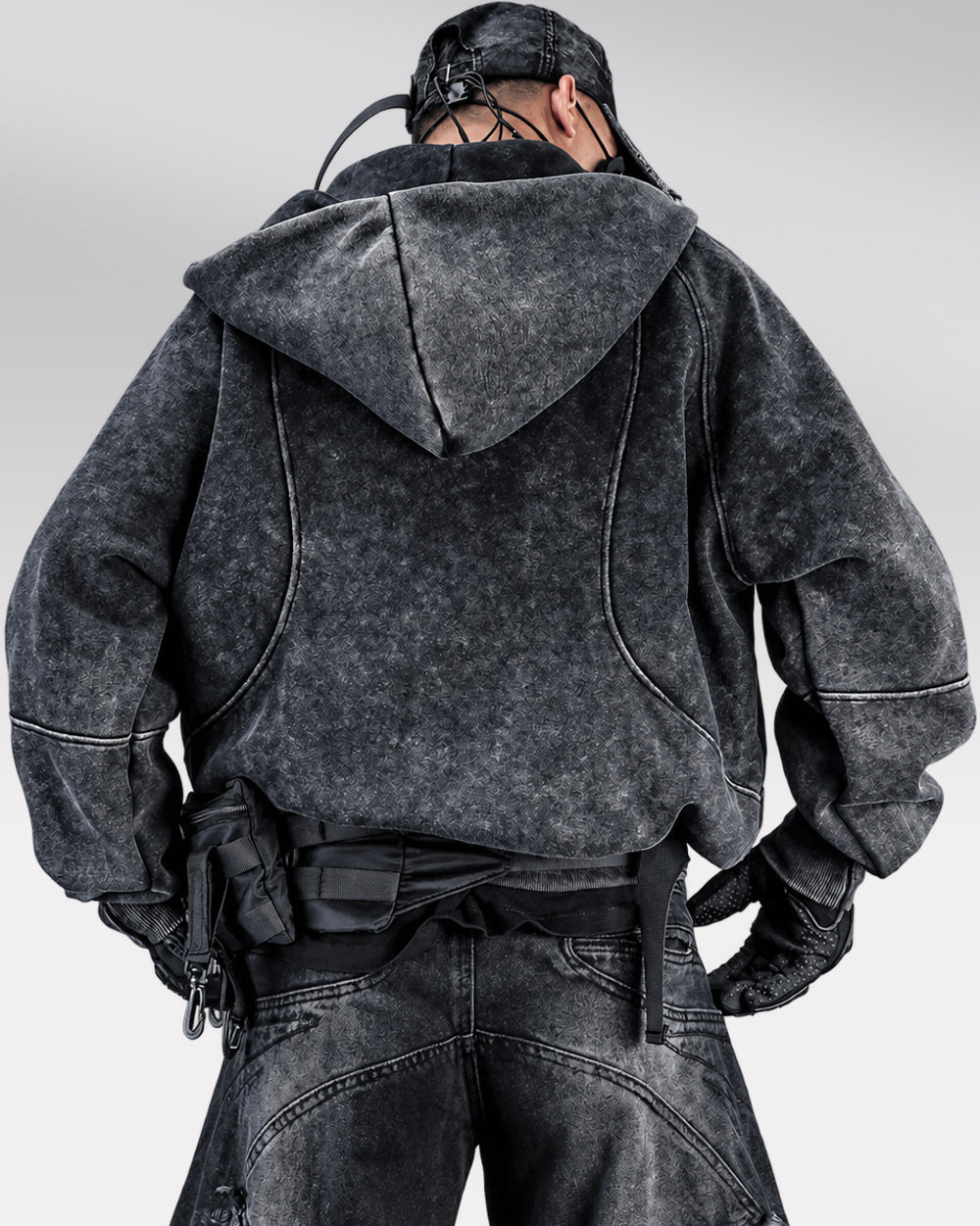 Asymmetrical zipper hoodie "Ama" in black, rear view with hood resting on back