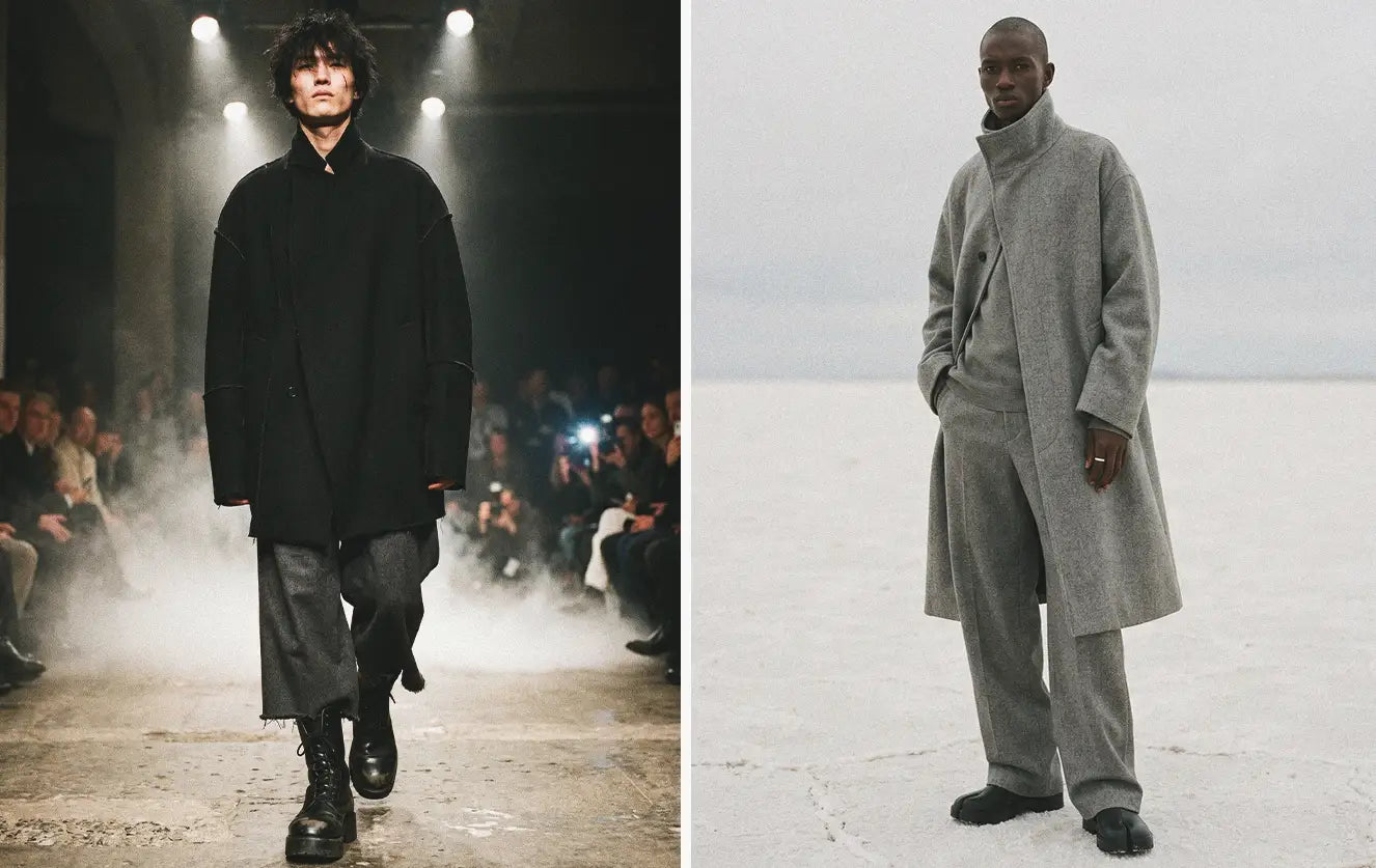 Avant-garde fashion diptych showing a Japanese male model walking a runway in an oversized black wool coat and washed grey trousers next to a Black male model wearing a heather grey wool asymmetric coat on white salt flats