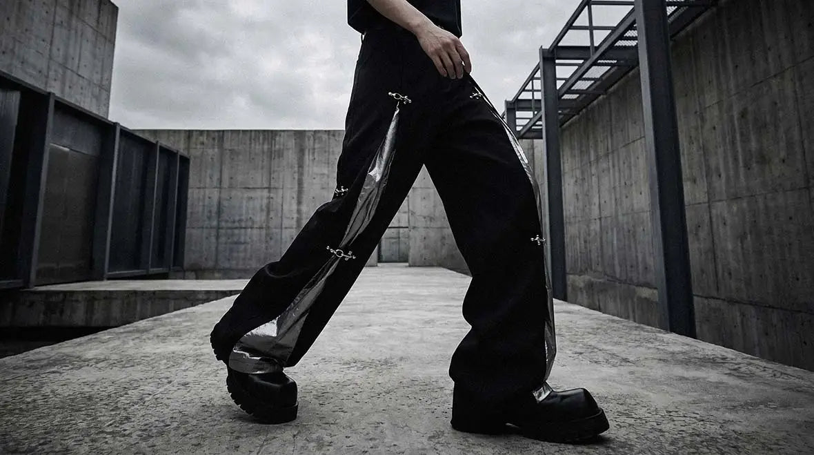 Dark urban outfit featuring avant garde pants with layered styling