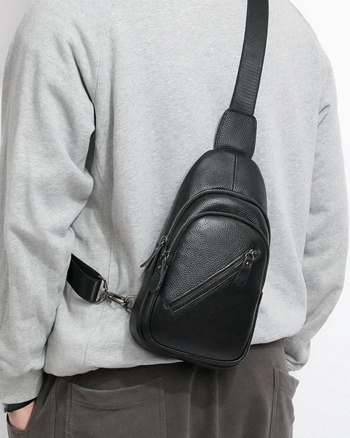 man wearing the Black leather crossbody bag "Zuru"