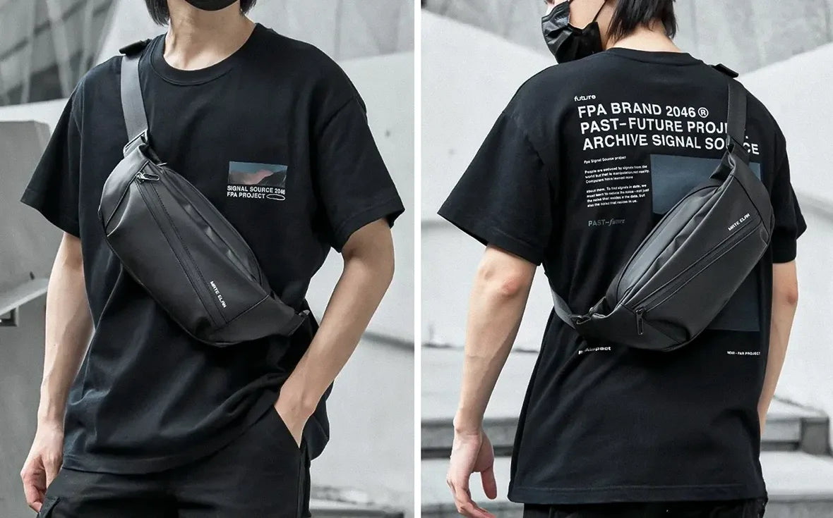 man with a black t-shirt wearing a cross body bag