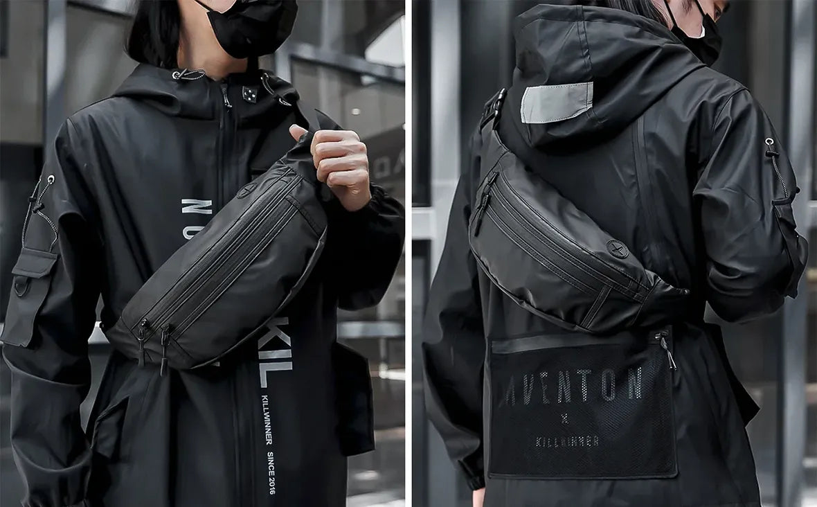 man in black techwear outfit wearing crossbody bag