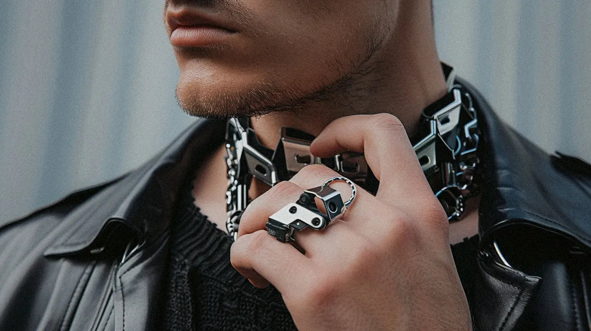 hand of a man wearing cyberpunk jewelry