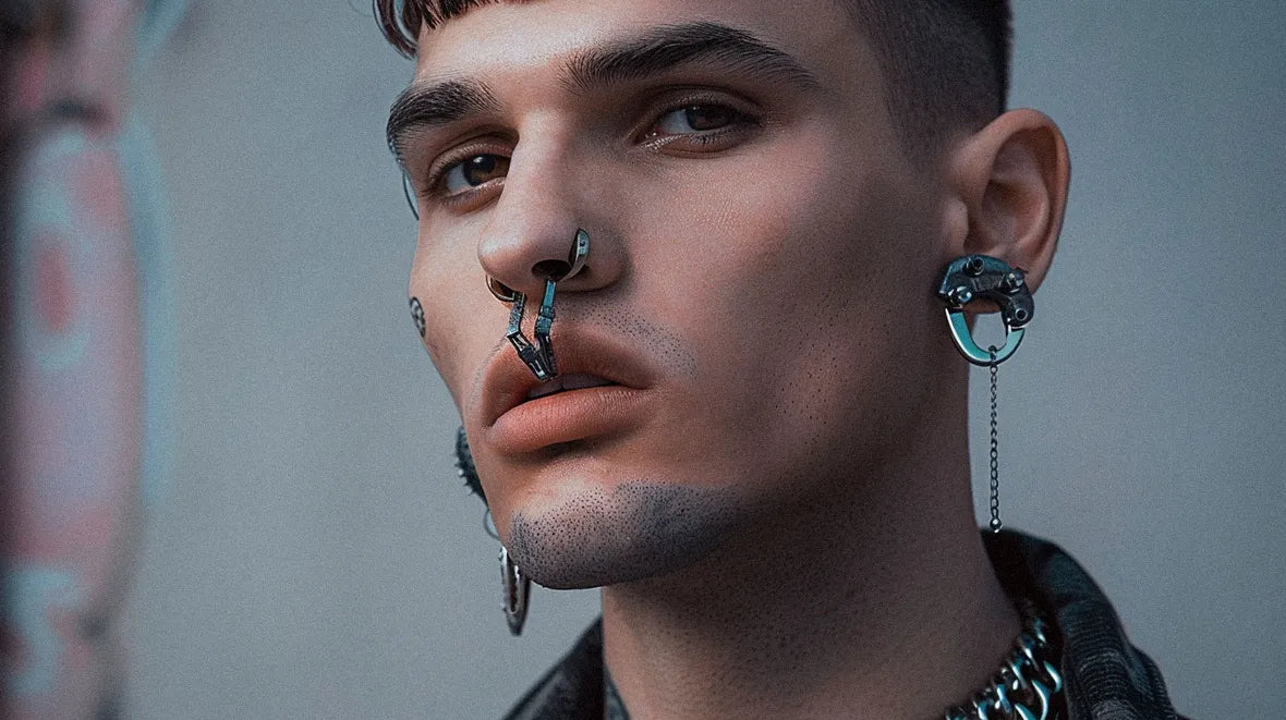 face of a man with cyberpunk jewelry