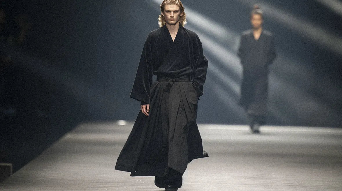 blonde male model in hakama pants during a runway