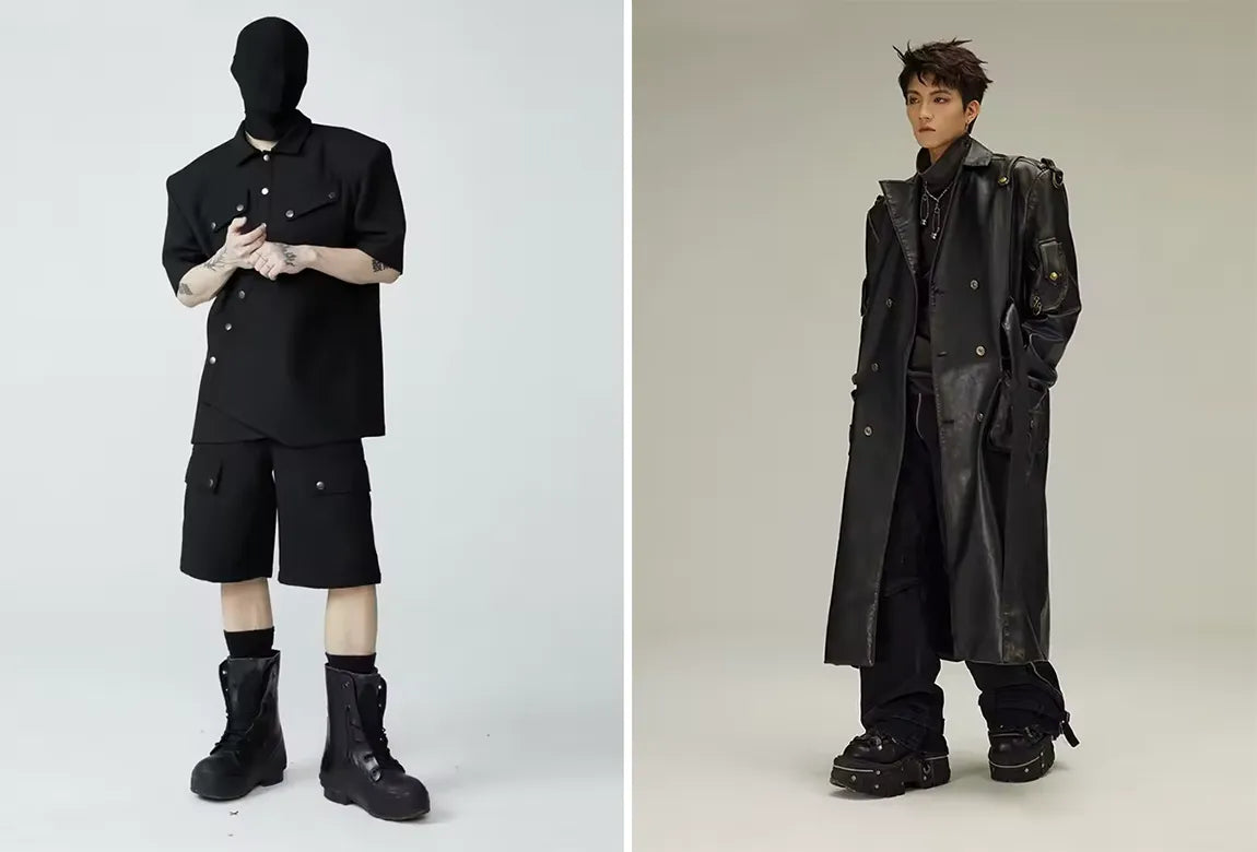 Two models showcasing avant-garde opium clothing styles, with one in a black oversized shirt and shorts, and the other in a dramatic black leather trench coat.
