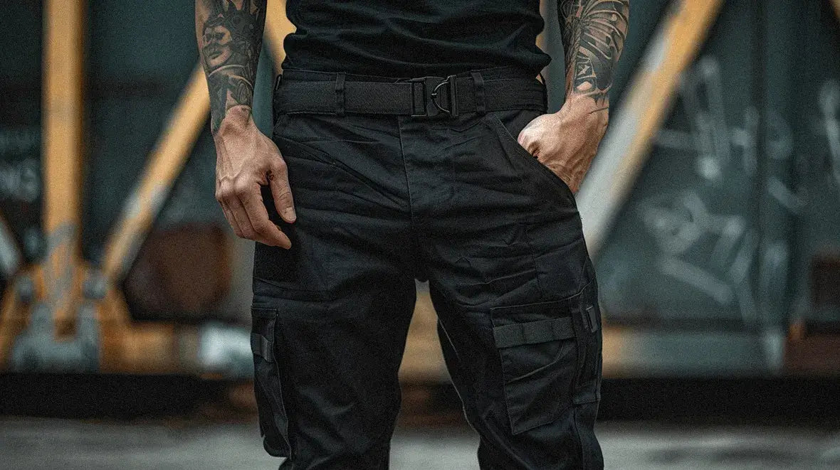 man with tattoos wearing a techwear belt