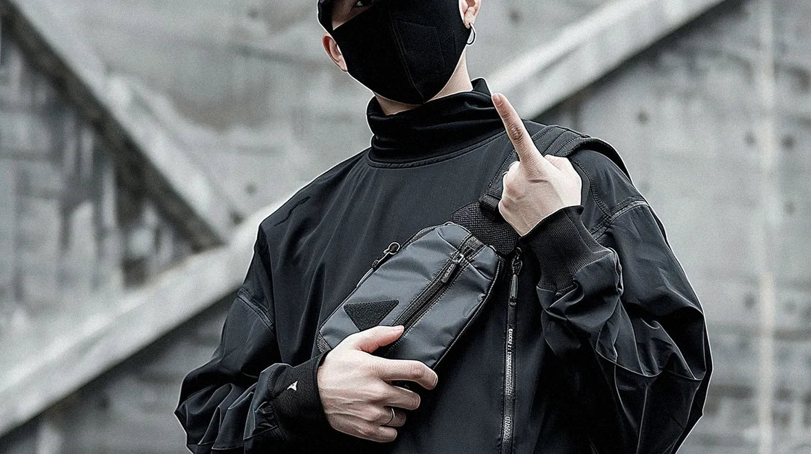 an asian man in techwear outfit wearing a techwear fanny pack