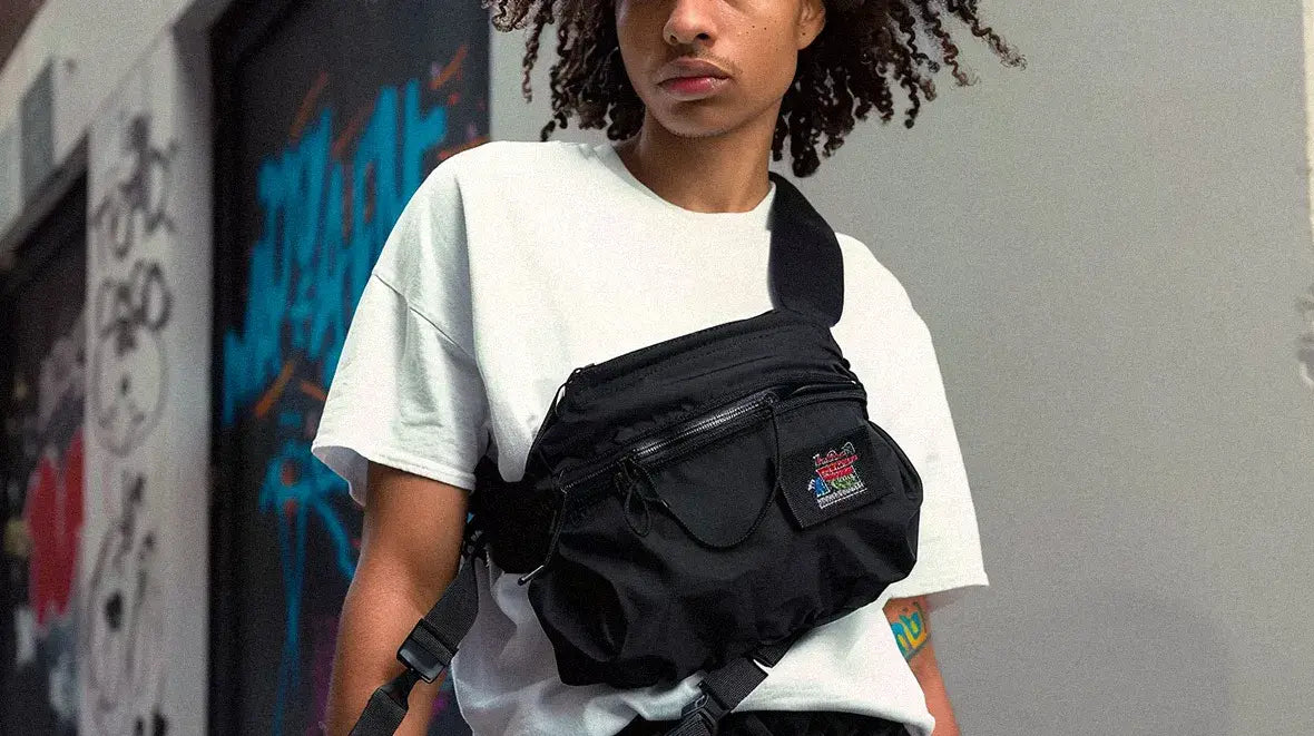 a black man wearing a techwear fanny pack