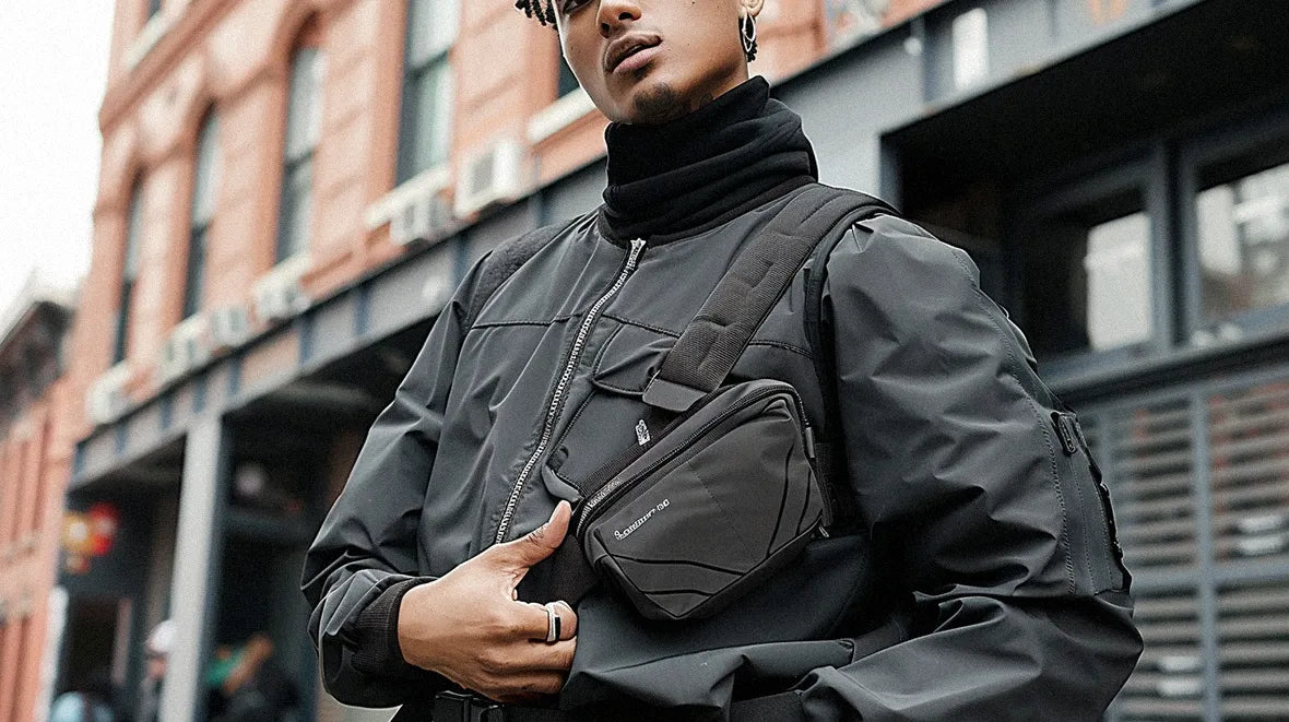 a light skin man wearing a techwear fanny pack