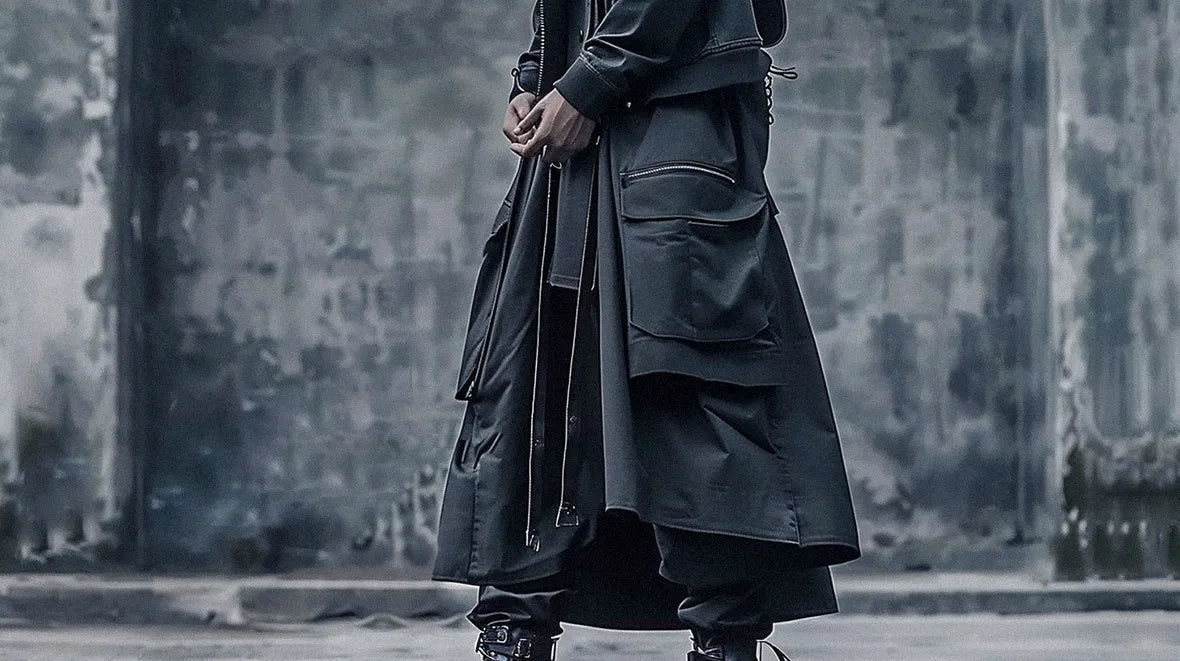 a young man wearing a techwear skirt