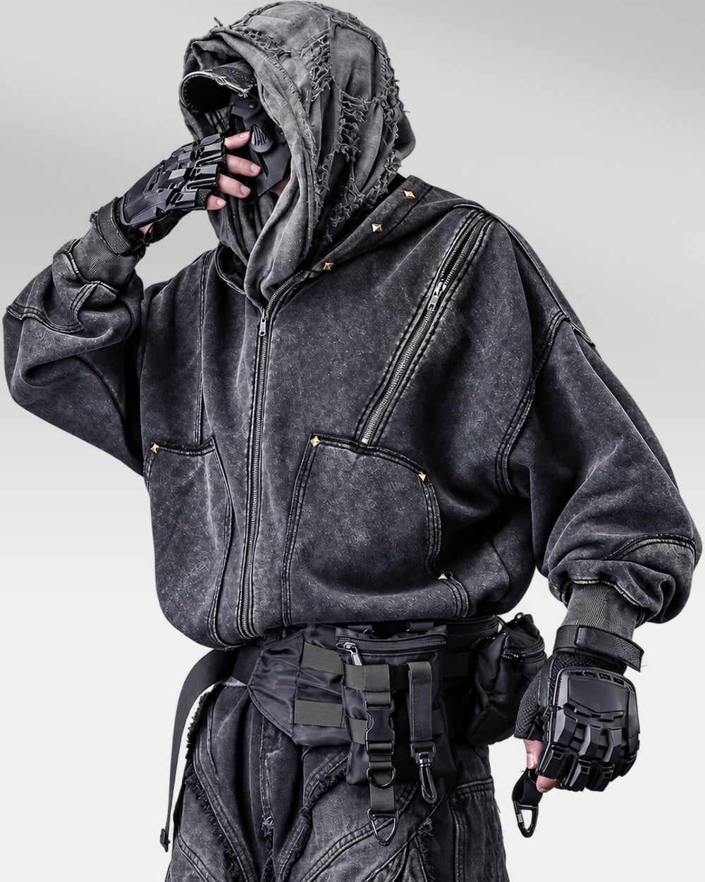 Vintage hoodie "Yosu" in black, three-quarter pose, hand near face