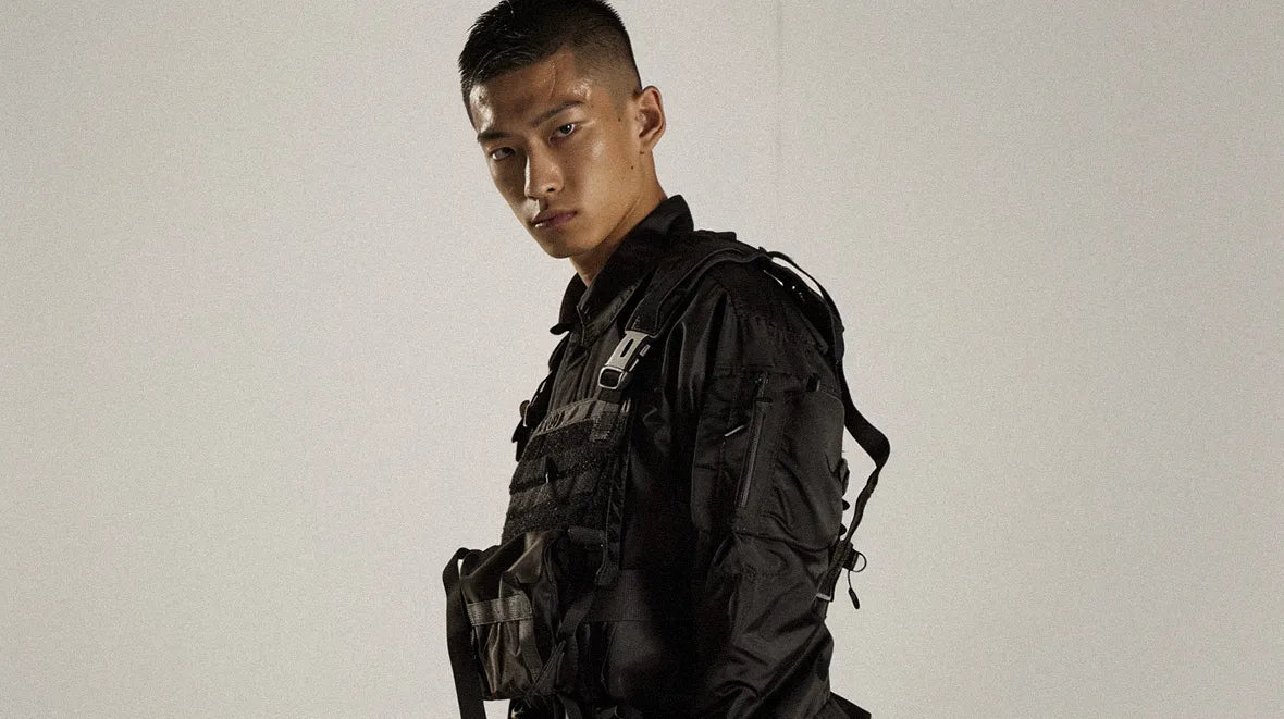 an asian man in warcore outfit