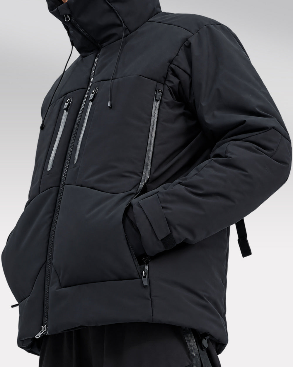 Waterproof Puffer Jacket Hinohe in black - model hero, hood up, three-quarter view