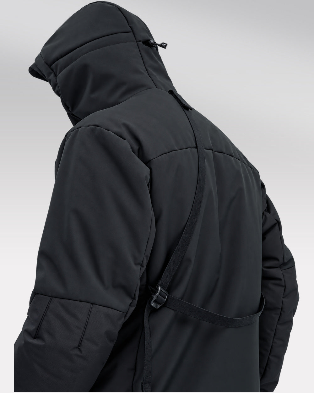 Waterproof Puffer Jacket Hinohe in black - rear view and carrying strap
